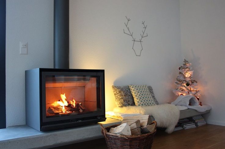 Living room installed Black Stuv 16 cube with Burning wood