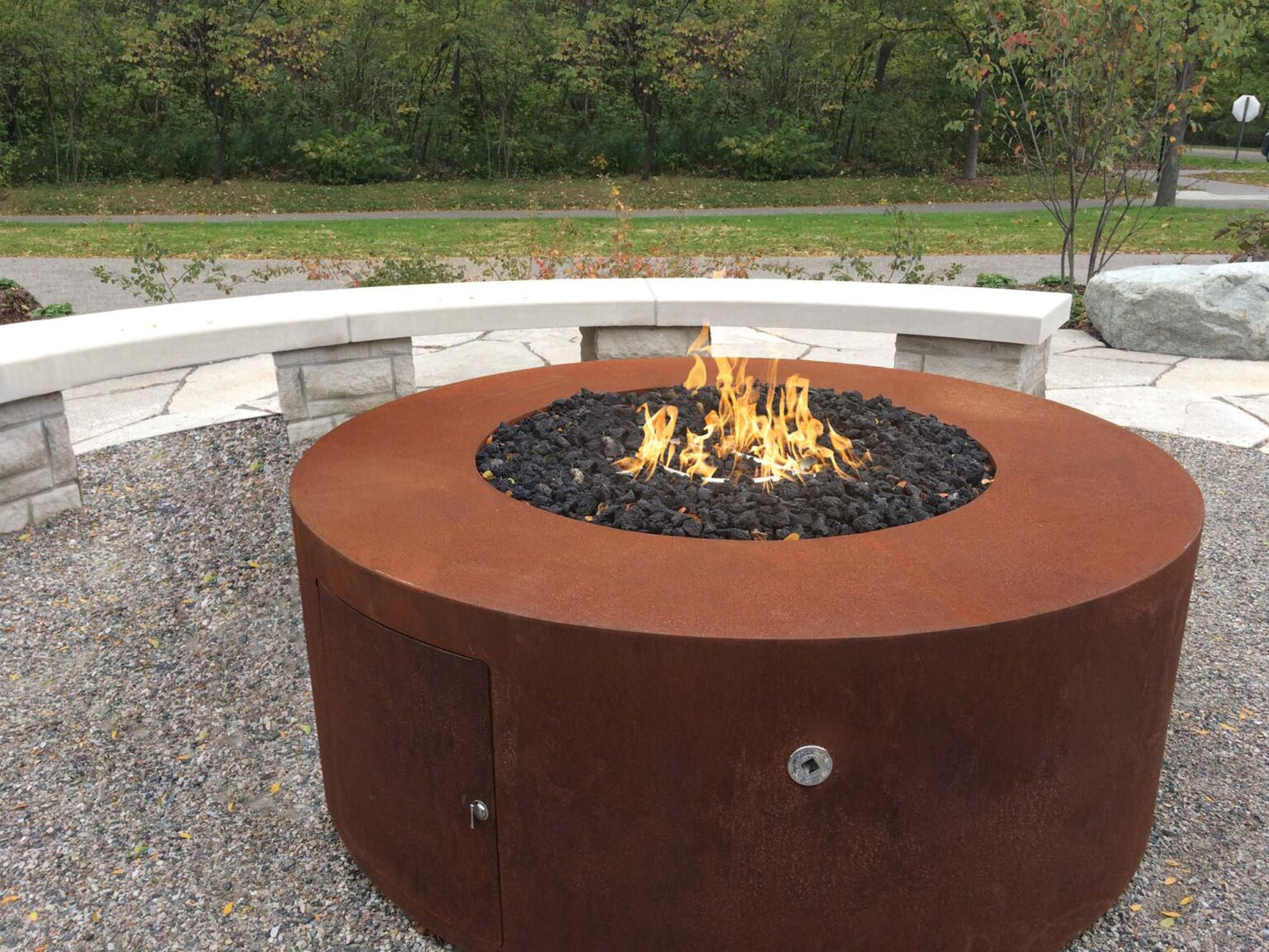 Outdoor view of The outdoor plus powdered coated 18" tall unity fire pit