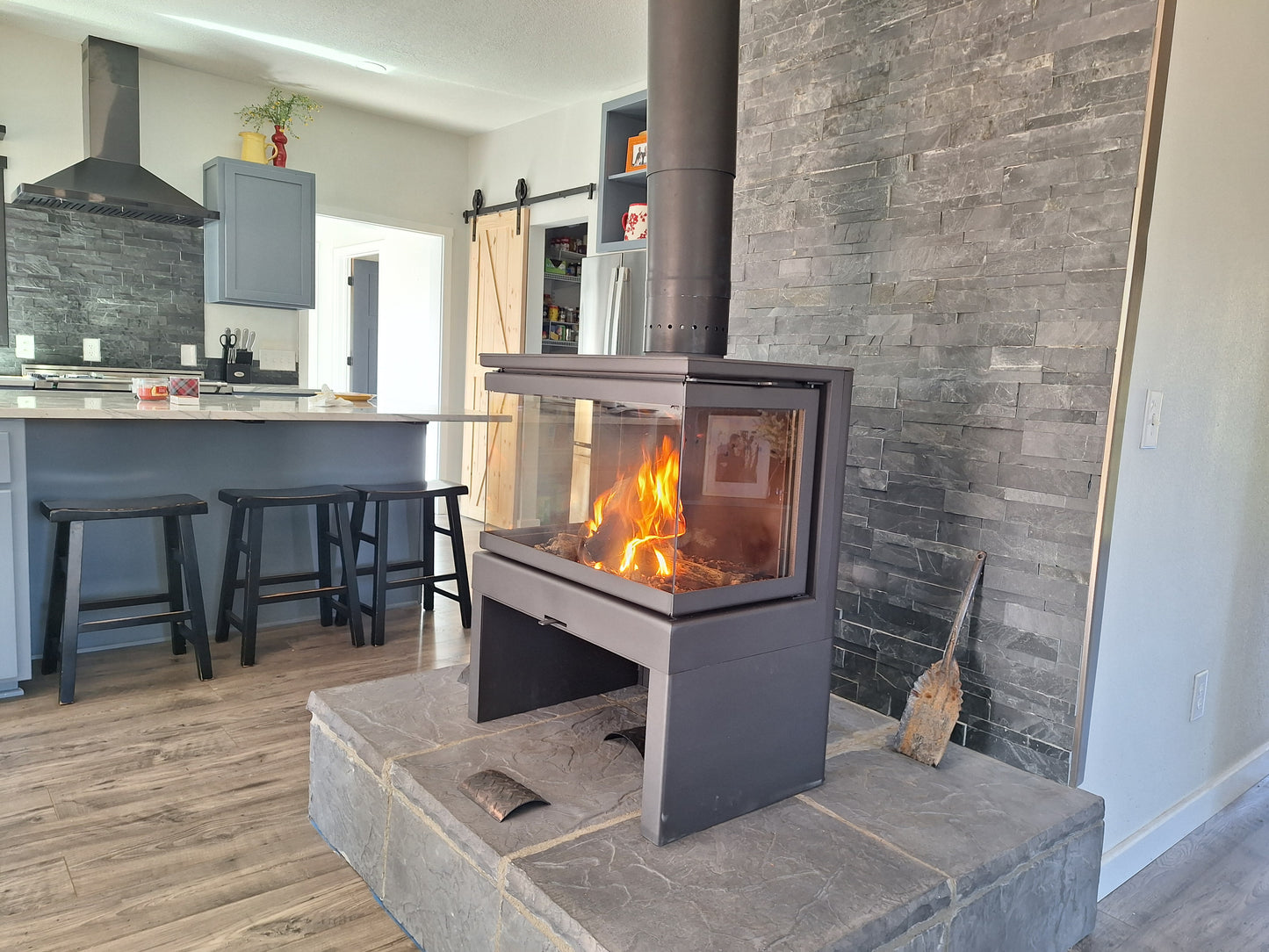 Actual photo of our KFD Ariana Delivered and installed in our customers home. Wood Burning Scandinavian style fireplace. We also do a lot of Flue pipe as well