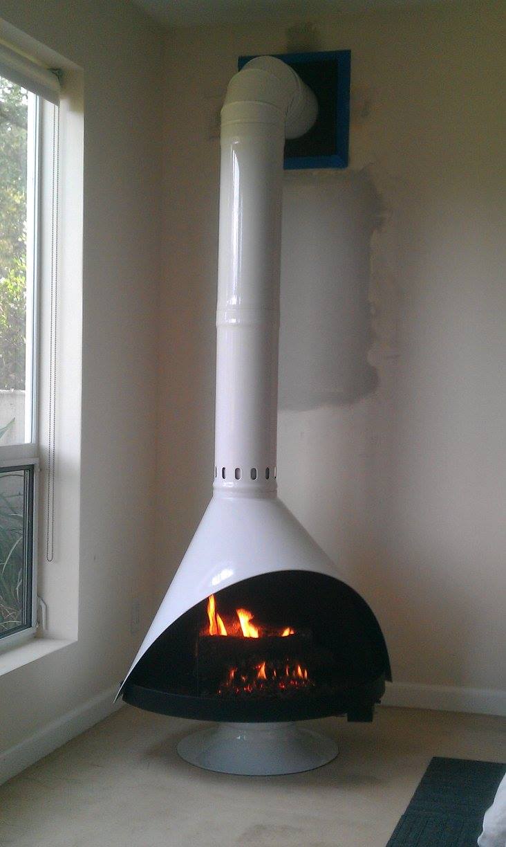 Malm Zircon White with White Matching Base and 90 degree Elbow for the Chimney Flue Pipe on thie Mid Century Modern Cone Fireplace by MALM The Zircon high Sierras Fireplace is scandinavian style
