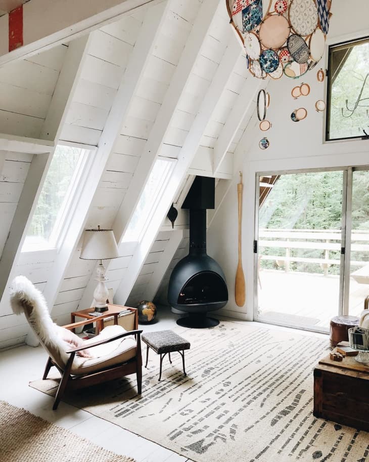 Malm Zircon cousin is the fire drum 3 its like a bowl shape saucer shaped fireplace mcm style sleek design and great valueCozy living room with a fireplace, chair, and large windows.