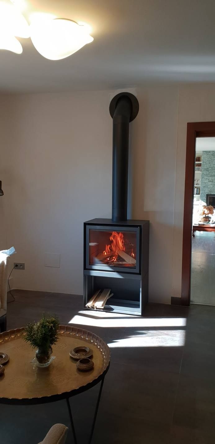 Grey Stuv 16-H model wood burning stove with burning woods