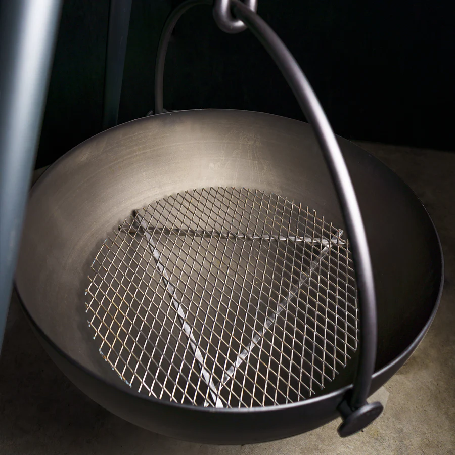 Silver Outdoor Wood Burning Fire Pit. Used in the garden, the Cow Cauldron is able to be moved anywhere - because it will not heat up the ground under it, move it to have a fire anywhere you please. Cowboy Cauldron the Wrangle 36": can be a grill can be a patio heater and is a beautiful piece of art work