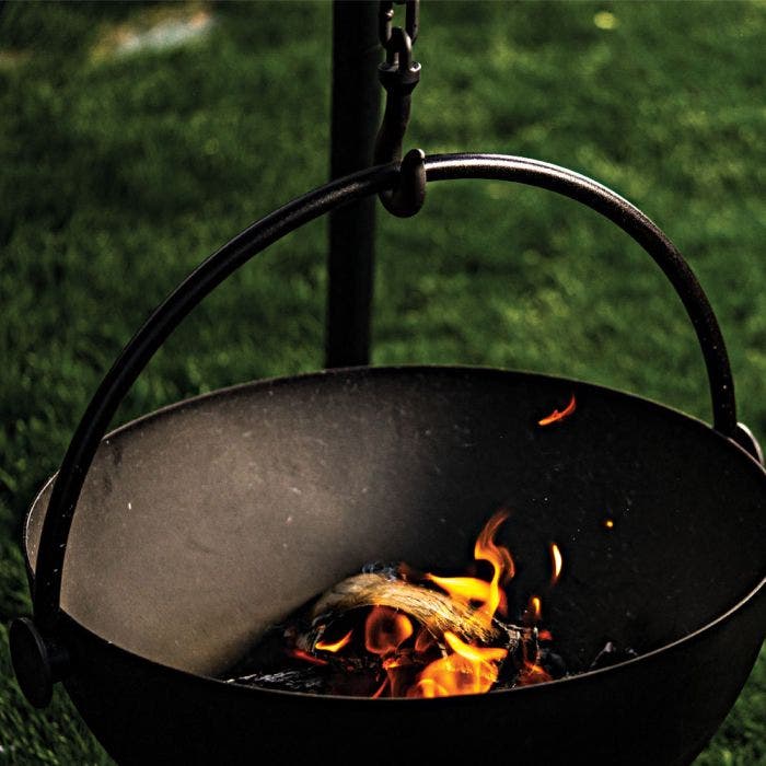 Outdoor Cooking/Grill Pot with Burning Flame- Used in the garden, the Cow Cauldron is able to be moved anywhere - because it will not heat up the ground under it, move it to have a fire anywhere you please. Cowboy Cauldron the Wrangle 36": can be a grill can be a patio heater and is a beautiful piece of art work. BACKYARD SOPHISTICATION, IN A MODULAR FLOATING FIRE PIT PIECE DESIGNED TO BE FUNCTIONAL AND ARTISTIC
The cowboy Cauldron Wrangler is a Modular Floating Firepit that with not only heat up the night