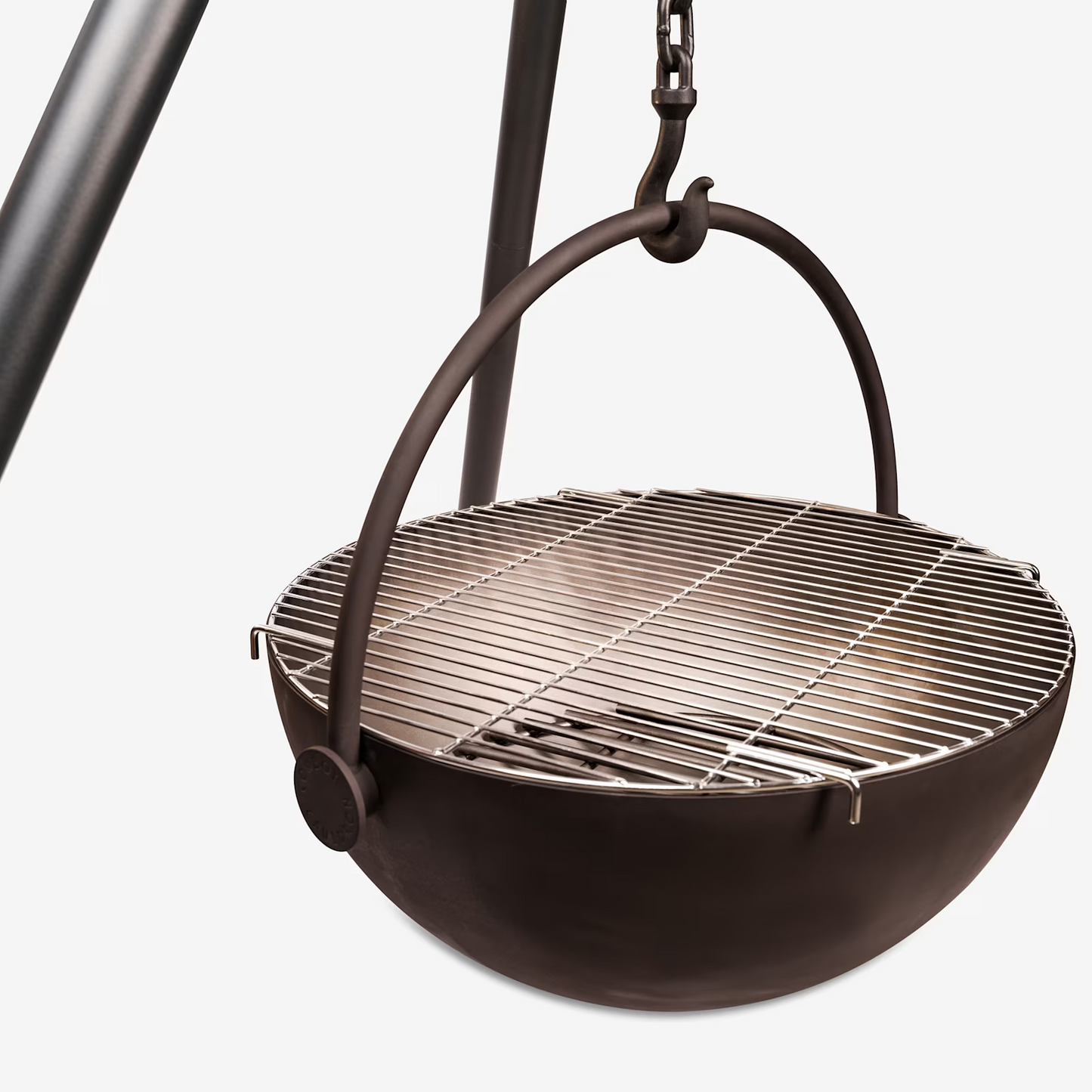 Clear Brown picture of Tripod Stand hang Wood burning Fire pit Pot Used in the garden, the Cow Cauldron is able to be moved anywhere - because it will not heat up the ground under it, move it to have a fire anywhere you please. Cowboy Cauldron the Wrangle 36": can be a grill can be a patio heater and is a beautiful piece of art work