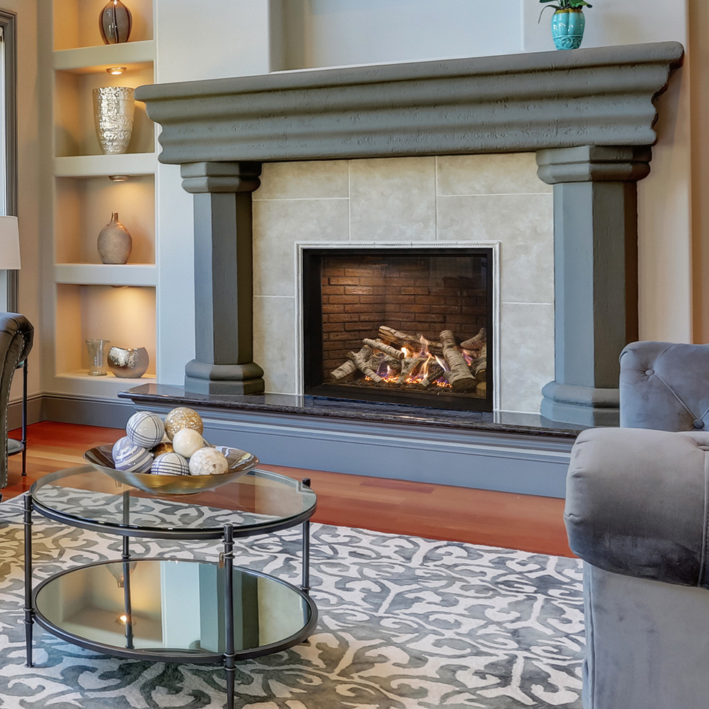 Montigo Paragon Single Sided Modern Custom Indoor Gas Fireplace Inserts with beveled Trim kit (Insets) and TruFlame gas Technology to ensures maximum flames and a beautiful ember glow with minimum emissions into a wall in a living room room.
Highly Efficient and clean burning Direct vent indoor Gas Fireplace. Best Ideas for Fireplace at Smokey Mountain Fireplace.
Simplify your life with the ease and beauty of an indoor gas fireplace. Gather family and friends in front of bold flames and striking designs.