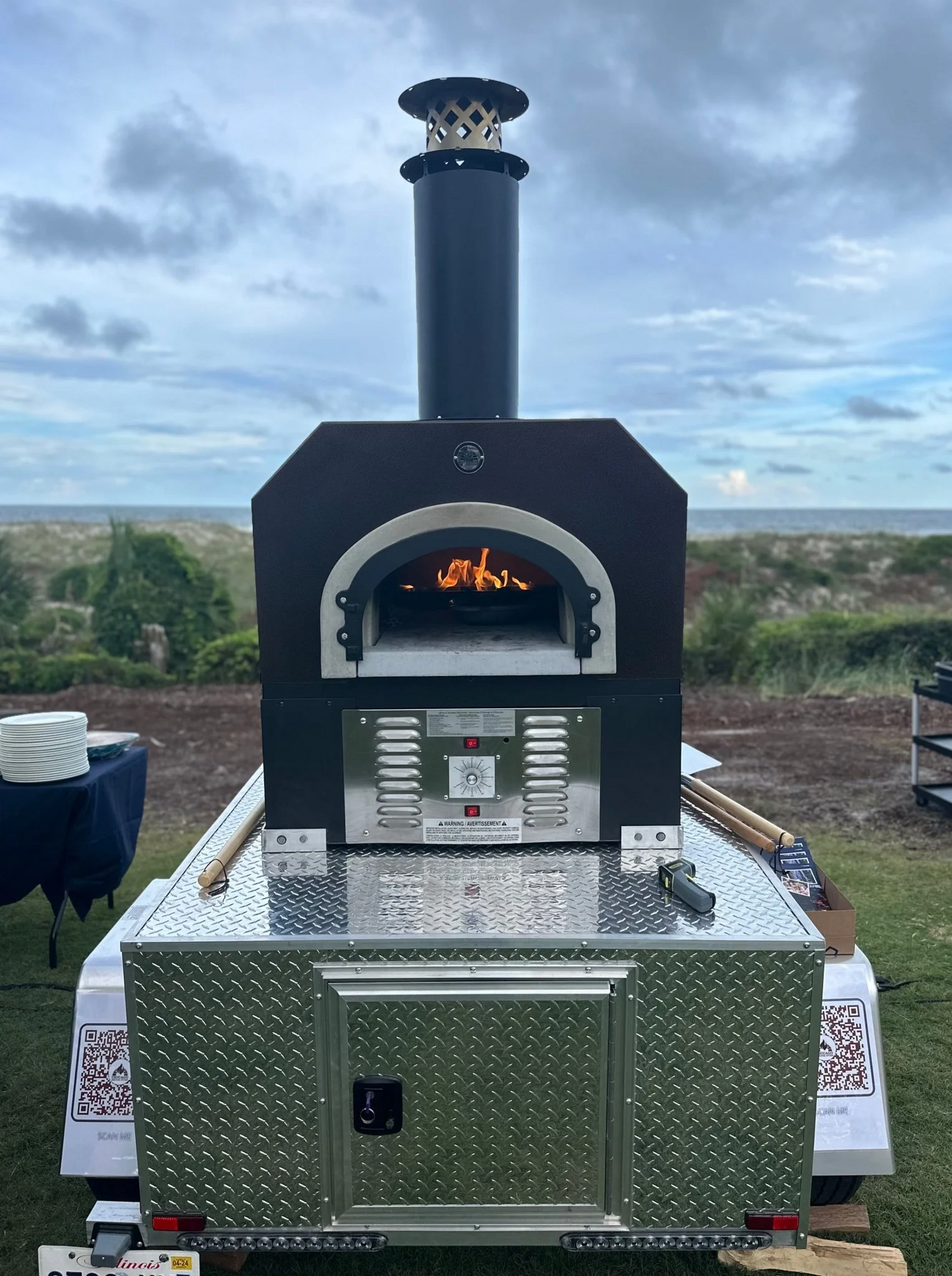 CBO 750 Tailgater Wood-fired pizza oven, outdoor with a scenic background