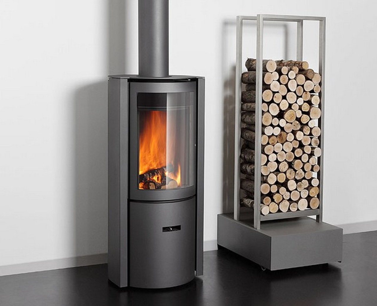Modern stove with fire burning inside, next to a metal log holder filled with wood.
modern fireplace
designer fireplace
luxury fireplace
beautiful fireplace
modern wood fireplace
contemporary fireplace
STUV 30c
rotating wood fireplace
clean burning fireplace
European fireplace design
Competitor / Comparison Keywords:
Focus fireplace alternative
Ortal fireplace alternative
Rais fireplace Malm fireplace
modern linear fireplace