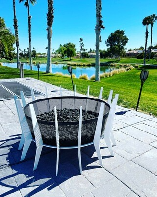 Outdoor View of 17" white retrofire Mid-century Gas Fireplace with decorative rocks - Modfire