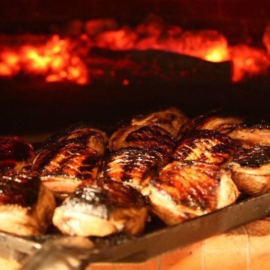 Grilling inside CBO-750 tailgater pizza oven