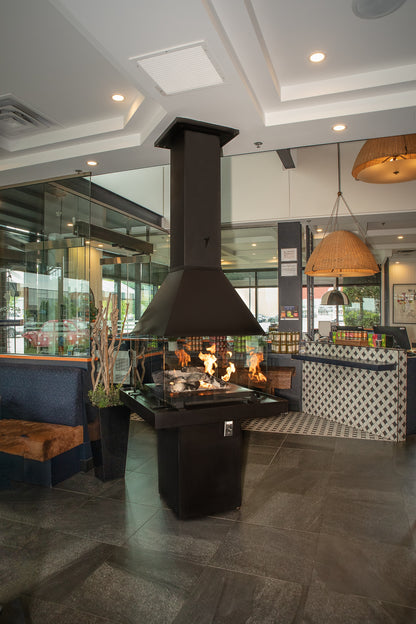 Modern interior with a Matte Black Don Bar 9200 series fireplace and stylish decor