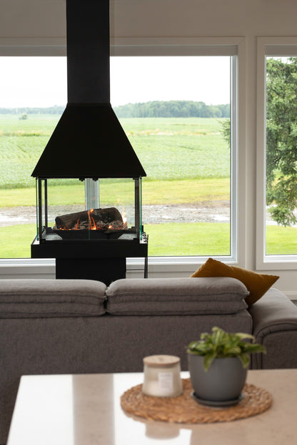 Matte Black Gas Burning Don bar 9200 series Fireplace in a Modern living room mid century modern sleek Scandinavian all glass custom designed see through round fireplace Malm Style Carousel Style Focus fireplace floating fireplace UFO style floating overing see through round all glass fish tank Malm MCM For a high-end, architectural piece like the Don-Bar 9200 Series, your SEO strategy needs to target luxury homeowners and designers who are searching for "statement" heating. Malm Carousel or Focus Ergo 