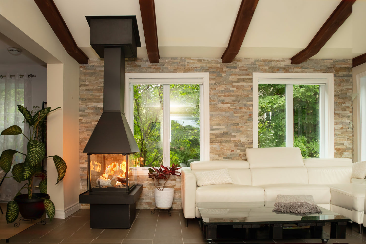 Matte Black Don Bar 9200 series in a Modern living room with black chimney connected to the ceiling with white sofa, and large windows.