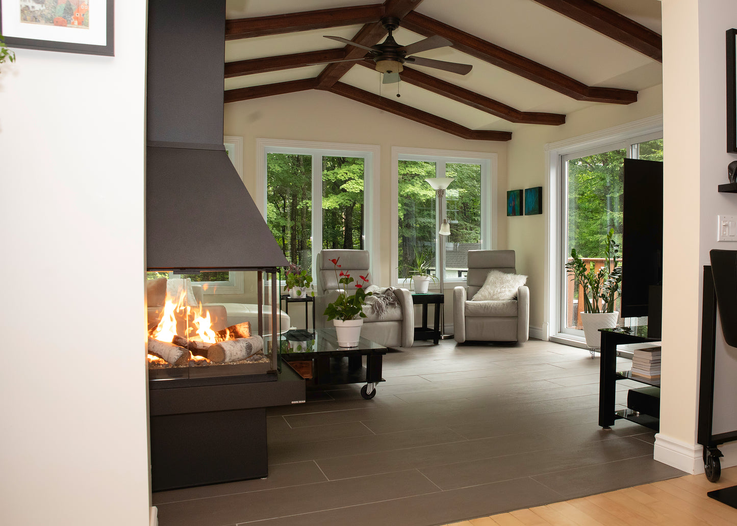 Matte Black Don Bar 9200 Series in a Modern Living Room with large windows and outdoor view