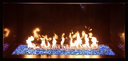 Up close view of Contemporary Gas Glass Fireplace with flames burning in a dark setting