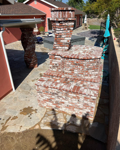 Brick outdoor Wood-fired pizza oven DIY KIT with wood storage on a patio outdoor kitchen setup ready to make your perfect outdoor kitchen. CBO 1000 wood fired Pizza Oven, natural gas pizza oven, DIY pizza oven kit, residential countertop pizza oven, Chicago Brick Oven, backyard pizza oven, outdoor kitchen pizza oven, hybrid pizza oven for home. Alfa Pizza Oven 3 pizze but better made in America, Wood Burning oven -Ooni Gozney.