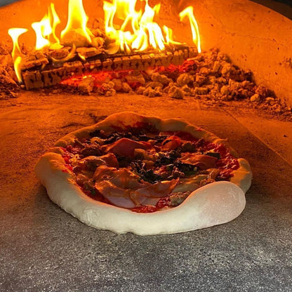 Inside view of CBO-750 tailgater pizza oven with pizza inside