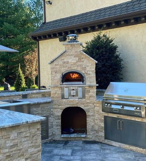 Dual fuel Natural gas and wood-fired outdoor residential pizza oven CBO-750 Hybrid Pizza oven DIY Kits with burning flame Inside the Dome in a backyard setting. The DIY kit includes everything you need to build your custom pizza oven. 
High efficient two gas burner system, ready to finish enclosure bundle, Fireproof and weather-resistant design chicago brick oven 750 hybrid pizza oven. 
Countertop Pizza oven, backyard pizza oven, outdoor kitchen pizza oven similar to Premio pizza oven kit-Forno.