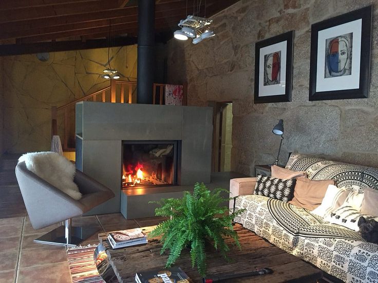 Living room with stuv 21-95DF enclose with thin edge frame and Grey Front panel, and  sofa, and decorative items.