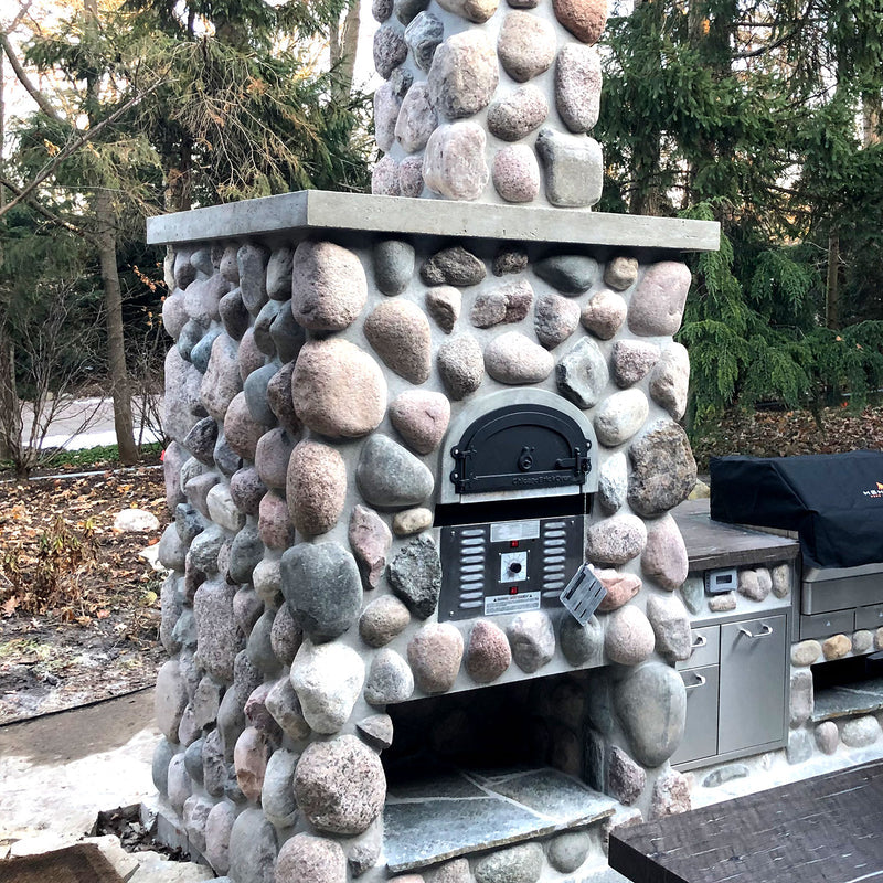 Brick outdoor Wood Gas Hybrid pizza oven with wood storage on a patio outdoor kitchen setup ready to make your perfect outdoor kitchen. CBO 750 Hybrid Pizza Oven, dual fuel pizza oven, outdoor wood fired pizza oven, natural gas pizza oven, DIY pizza oven kit, residential countertop pizza oven, Chicago Brick Oven, backyard pizza oven, outdoor kitchen pizza oven, hybrid pizza oven for home. Alfa Pizza Oven 3 pizze but better made in America  with built in Gas BBQ LPG NG Pizza Oven Wood Burning Ooni Gozney