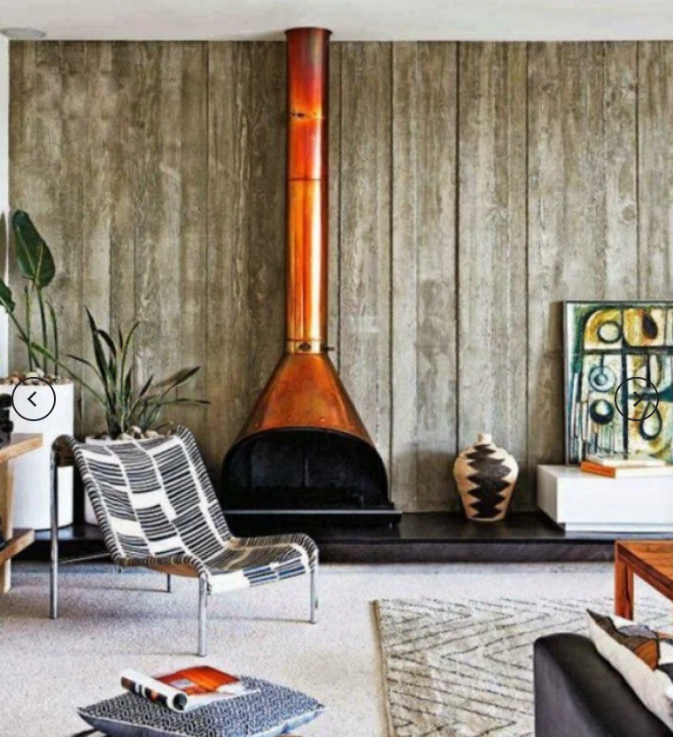 Copper top finish Malm zircon 34"  wood Burning fireplace with the Patina on it in a modern living rooom
