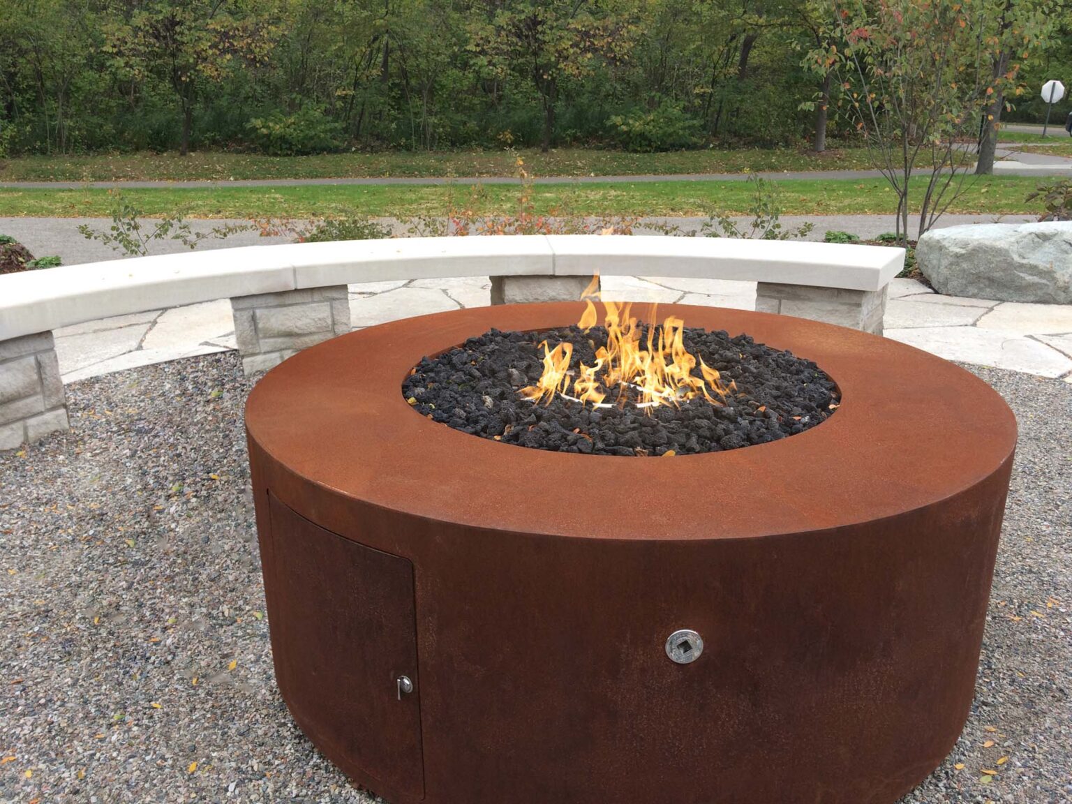 Outdoor view of The outdoor plus powdered coated 18" tall unity fire pit