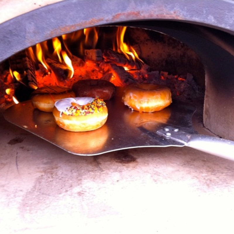 Brick outdoor Wood Gas Hybrid pizza oven with wood storage on a patio outdoor kitchen setup ready to make your perfect outdoor kitchen. CBO 750 Hybrid Pizza Oven, dual fuel pizza oven, outdoor wood fired pizza oven, natural gas pizza oven, DIY pizza oven kit, residential countertop pizza oven, Chicago Brick Oven, backyard pizza oven, outdoor kitchen pizza oven, hybrid pizza oven for home. Alfa Pizza Oven 3 pizze but better made in America  with built in Gas BBQ LPG NG Pizza Oven Wood Burning Ooni Gozney