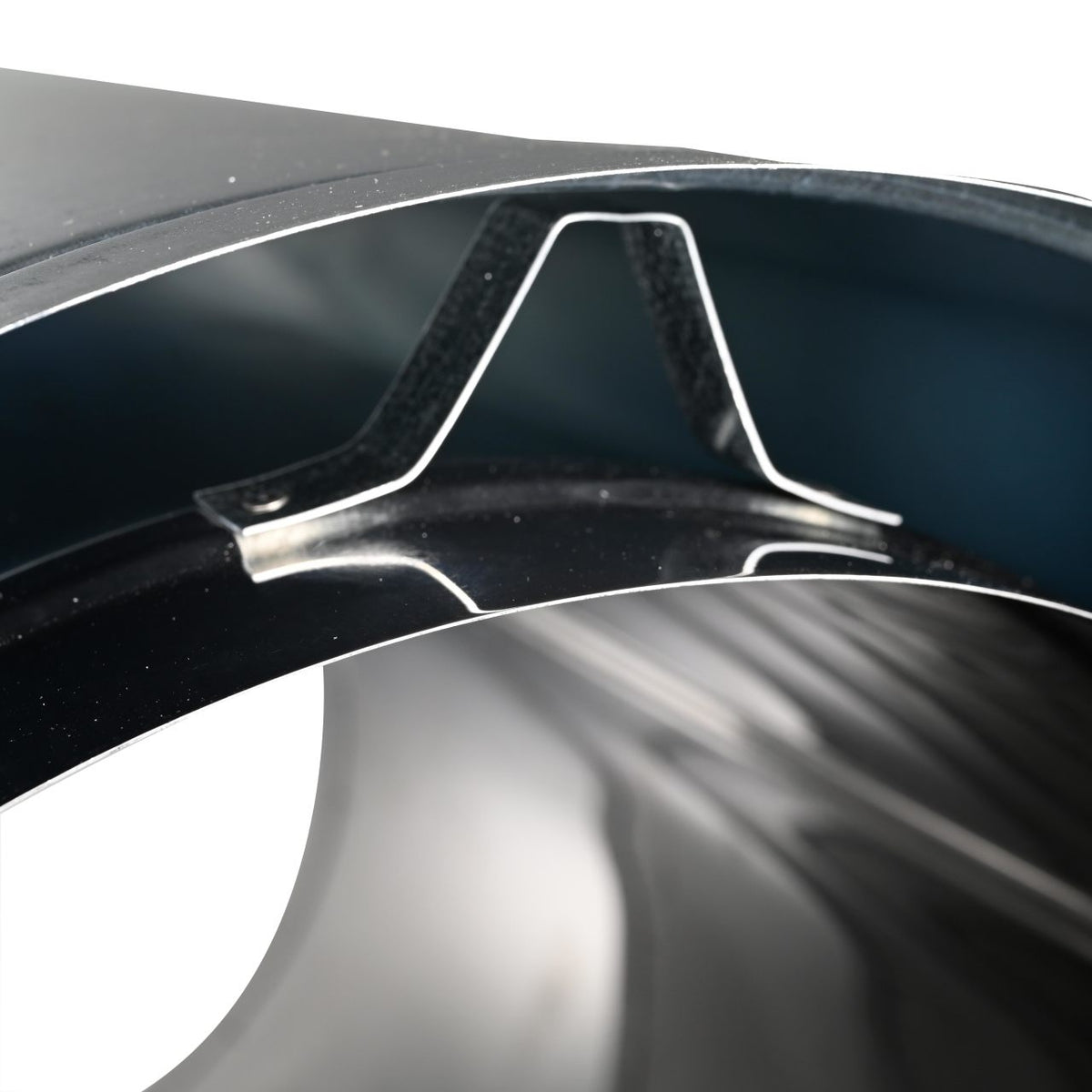 close-up inner opening view of stainless  steel duratech II chimney pipe showing a circular black metal wall. Exceptional factory-built all-fuel chimney pipe, lightweight design, double-wall, air-cooled chimney system for use with masonry fireplaces which burn wood, oil, coal, or gas. 