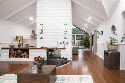 stuv 21-95DF in a white brick wall in a modern living room with wooden coffee table, and decorative elements.