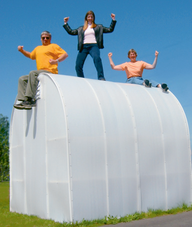 Three People standing on a garden greenhouse