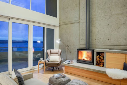 Living room installed grey Stuv 16-58 cube with Burning wood