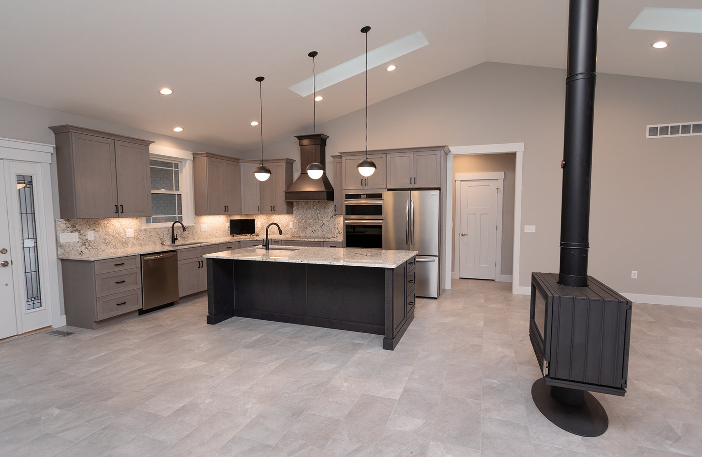 room center new construction remodel- custom chimney built room heat by Kinder construction Jotul MCM Malm MCM don bar stuv