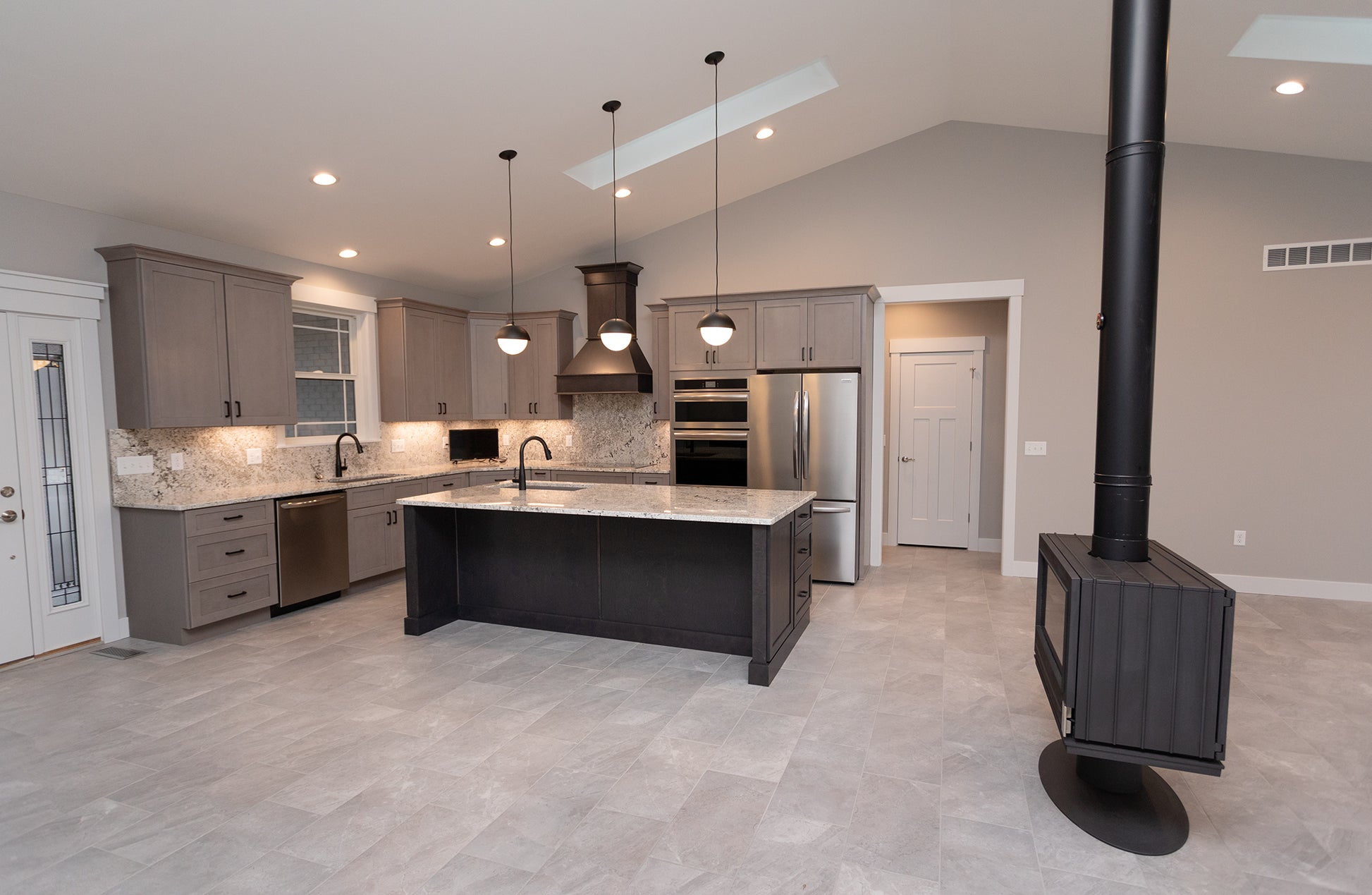 room center new construction remodel- custom chimney built room heat by Kinder construction Jotul MCM Malm MCM don bar stuv