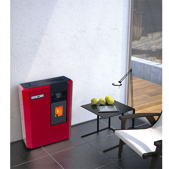 Red Compact high efficiency KFD floor and hanging wood heating pellet stove. with visible flame in a modern living room. Smart Control free standing rear and lateral flue outlet home heating pellet stove. Modern home fireplace. This product is similar to Comfortbilt Pellet Stoves HP50 Brown Modern Design Efficient, Cleveland Iron Works Pellet Stove PS20W-CIW, Harman Allure50 Pellet Stove, Drolet Eco-65R Pellet Stove, ComfortBilt Alpine Pellet Stove HP41, ATLAS Pellet Stove Boiler.
