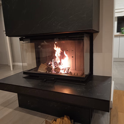 Albero 9C three sided built in indoor glass fireplace with a visible burning flame in a modern living room, Modern fireplace, Mid century Fireplace, Modern panoramic glass fire view fireplace. this fireplace is similar to; Dorako ECO MAX 7 3F 3 Sided Glass Wood Stove: Handmade Wall-Insert Glass Fireplace - STANDARD, A.Caminetti Crystal 80 3D Wood Burning Fireplace with 3 Glass Sides, Crystal 110 Max Wood-Burning Fireplace A.Caminetti 3 Glass Sides. Built with chimney pipe.