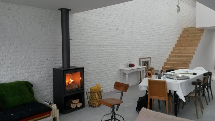 Black Stuv 16-H model wood burning stove with burning woods