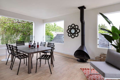 This is the Matte Black Malm Zircon 34" wood Burnng Cone Fireplace. See the 2 45s in the flue pipe are so they could use an existing flue box by duravent that was already installed in the home before they renovated the place to add this firepalce by Smokey Mountain Firepalces. this is one of the pre ordered Malm Zircon MCM that we will have in stock from time to time Mid-century modern Malm Zircon fireplace installed in designer living room – premium Malm wood-burning fireplace available from Smokey Mountai