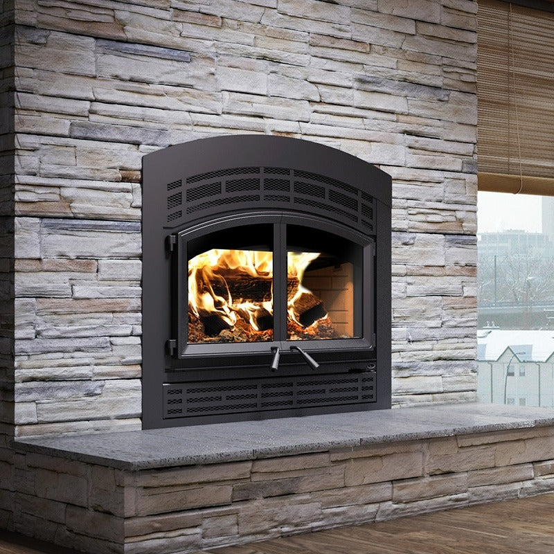 Valcourt Waterloo FP15A Indoor Built-in Wood burning fireplace with mission faceplate louver and a visible wood burning flame. 95,000 btu, 11 hr burning time, Largest model with high efficiency. Valcourt Waterloo FP15A is similar to, Napoleon High Country Series Wood Burning Fireplace, Ventis HE350 Zero Clearance Fireplace Insert Wood Burning 95,000 BTU 2,800 Sq. Ft New, Osburn Stratford II Wood Fireplace with Door, Majestic WarmMajic-II Wood Fireplace - WARMMAJIC-II.