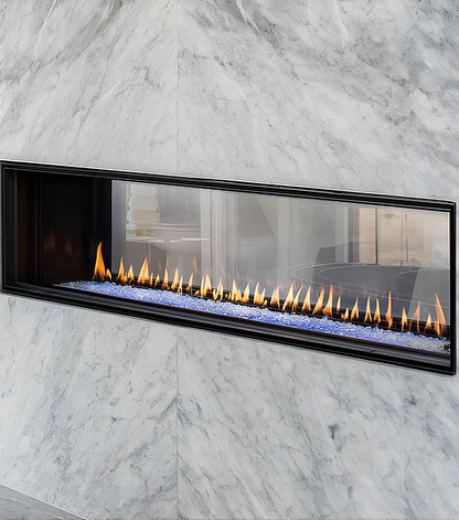 Close View of Montigo Distinction See through Built-In Linear Gas Fireplace with a visible flame in a Marble Wall. Double Sided Eco-friendly Indoor Gas Fireplace suitable for Home and commercial space.