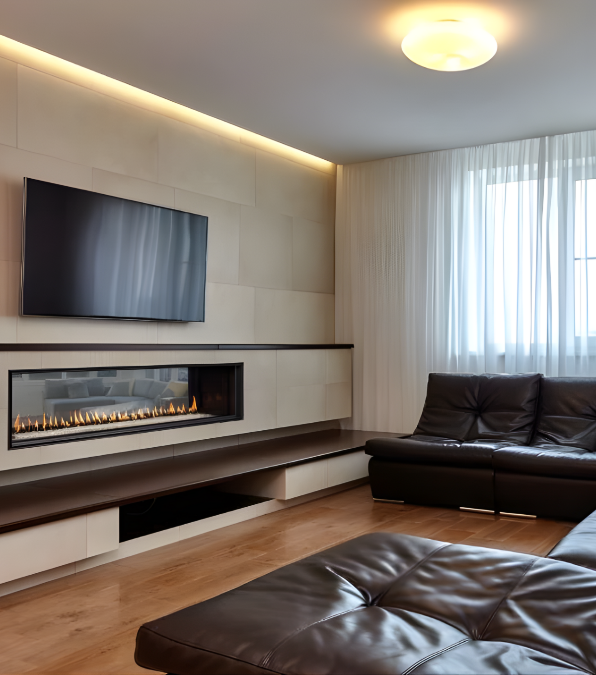 Angle View of Montigo Distinction See through Built-in Linear Gas Fireplace in a modern Living room with a wall Mounted television on the fireplace. Direct vent Fireplace that connects your space togeher.