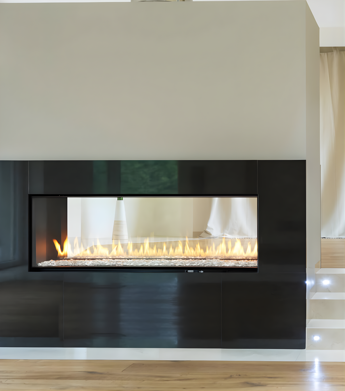 Luxury Montigo Exemplar See Through Built-In Linear Gas Fireplace Insert into a white Painted wall with Wooden Mantel and Artwork Above it. Eco-Friendly Modern Fireplace that connect your space together, suitable for homes and commercial space. Product Name	Montigo (not Montego)	Brand accuracy & authority.
Design Type	See-through / Double-sided	High-intent search volume.
Fuel/Vent	Direct Vent Gas	Technical SEO for homeowners/builders.
Competitors	Heat & Glo, Ortal, Regency	Captures "alternative to" traffic.