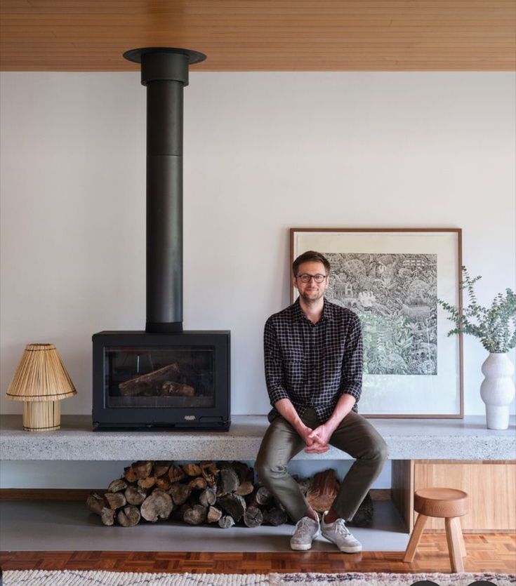 A man sitting beside Black Stuv 16-58 cube Modern wood burning stove In a living room. Upgrade your home with clean-air standard Freestanding Fireplace offering reliable performance, energy efficiency, and convenience at SmokeyMountainFireplaces.com.
The Stuv Wood Stove is similar to Supreme Novo 18 Wood Burning Stove, Osburn Matrix Wood Burning Stove with Blower, Majestic Trilliant 30 Freestanding Direct Vent Gas Fireplace - TRILLIANT30, Drolet Deco Nano Wood Stove db03215.