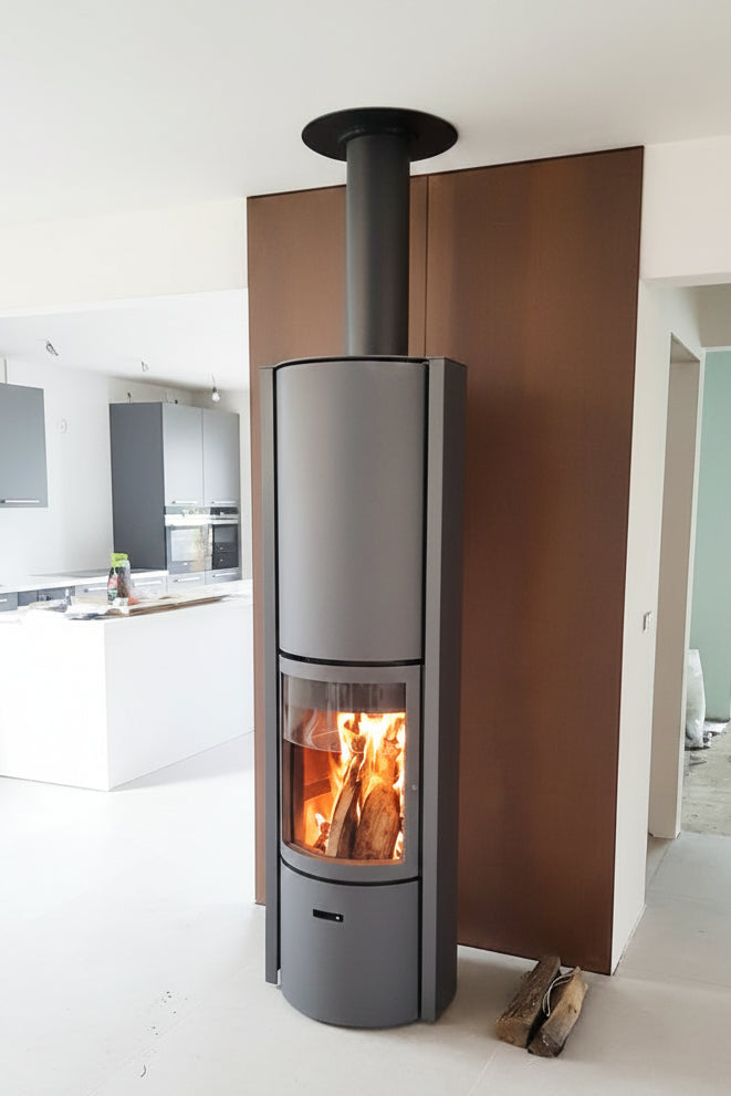 Modern fireplace with a basket of wood on a red and gray wall STUV Modern MCM Fireplace Cylinder fireplace Modern floating fireplace with steel plate for low clearance zero clearance fireplace background Flue Pipe Duravent