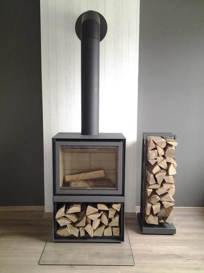 Black Stuv 16-H model wood burning stove with stacked logs