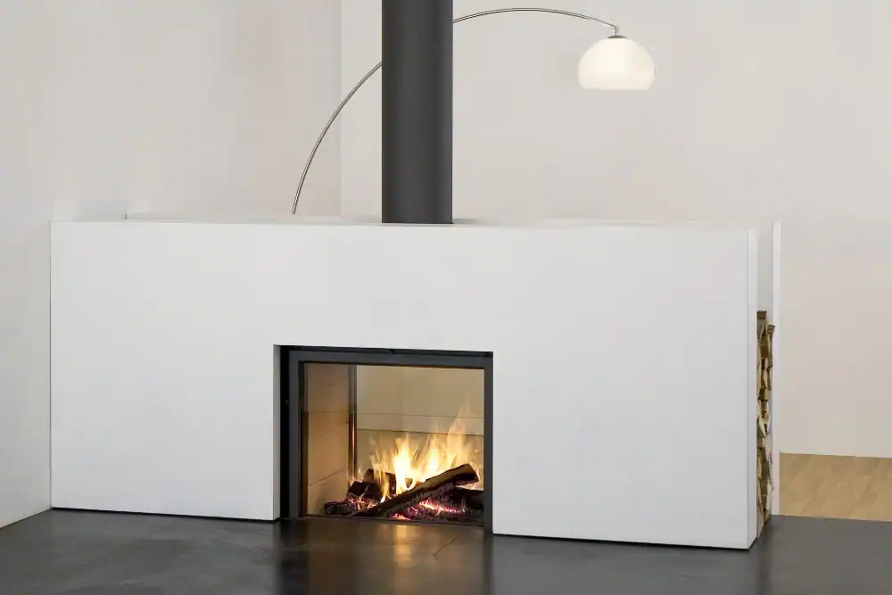 Thin edge frame stuv 21-95DF in a white painted room with a white front panel, black chimney and a curve lamp at the back