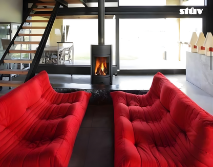 Grey Stuv 30C Freestanding highly efficient 360 degree rotating Modern wood burning stove with visible flame in a Modern living room with red sofas.
Premium and compact Indoor log burner fireplace with high-quality steel construction, Multi-Use Function and wide range BTU heat Output. 
Reduce your carbon footprint with Stuv 30C wood stove from Smokey Mountain Fireplace, Eco-friendly and Best for the money fireplace.