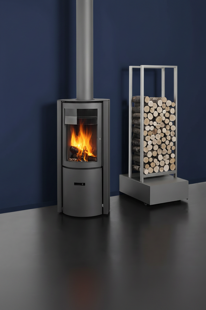 Modern wood stove with fire burning inside, next to a metal log holder filled with stacked logs on a white wall background. Modern room with large windows, wooden floor, and a freestanding stove. Modern cabin Modern fireplace with a basket of wood on a red and gray wall STUV Modern MCM Fireplace Cylinder fireplace Modern floating fireplace with steel plate for low clearance zero clearance fireplace background Flue Pipe Dura-vent
