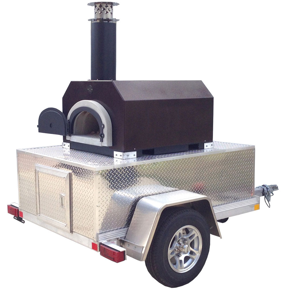 CBO 750 Tailgater wood-fired pizza oven mounted on a single-axle aluminum trailer.