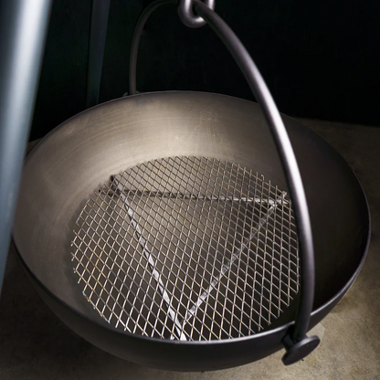 Silver Outdoor Wood Burning Fire Pit. Used in the garden, the Cow Cauldron is able to be moved anywhere - because it will not heat up the ground under it, move it to have a fire anywhere you please. Cowboy Cauldron the Wrangle 36": can be a grill can be a patio heater and is a beautiful piece of art work