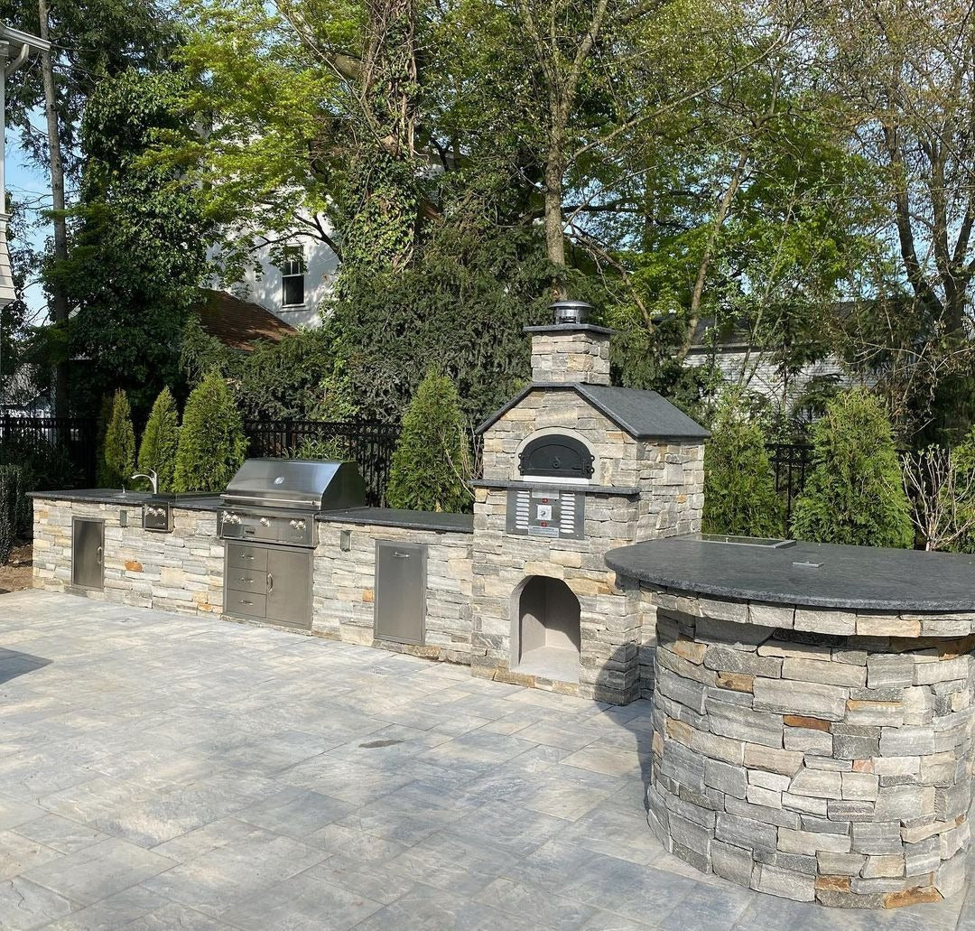 Dual fuel Natural gas and wood-fired built-in outdoor residential pizza oven CBO-750 Hybrid Pizza oven DIY Kits with burning flame Inside the Dome in a backyard setting. The DIY kit includes everything you need to build your custom pizza oven. 
High efficient two gas burner system, ready to finish enclosure bundle, Fireproof and weather-resistant design chicago brick oven 750 hybrid pizza oven. 
Countertop Pizza oven, backyard pizza oven, outdoor kitchen pizza oven similar to Premio pizza oven kit-Forno.